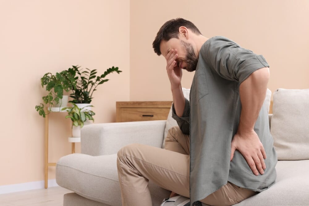 man_suffering_from_coccyx_pain-1.jpg